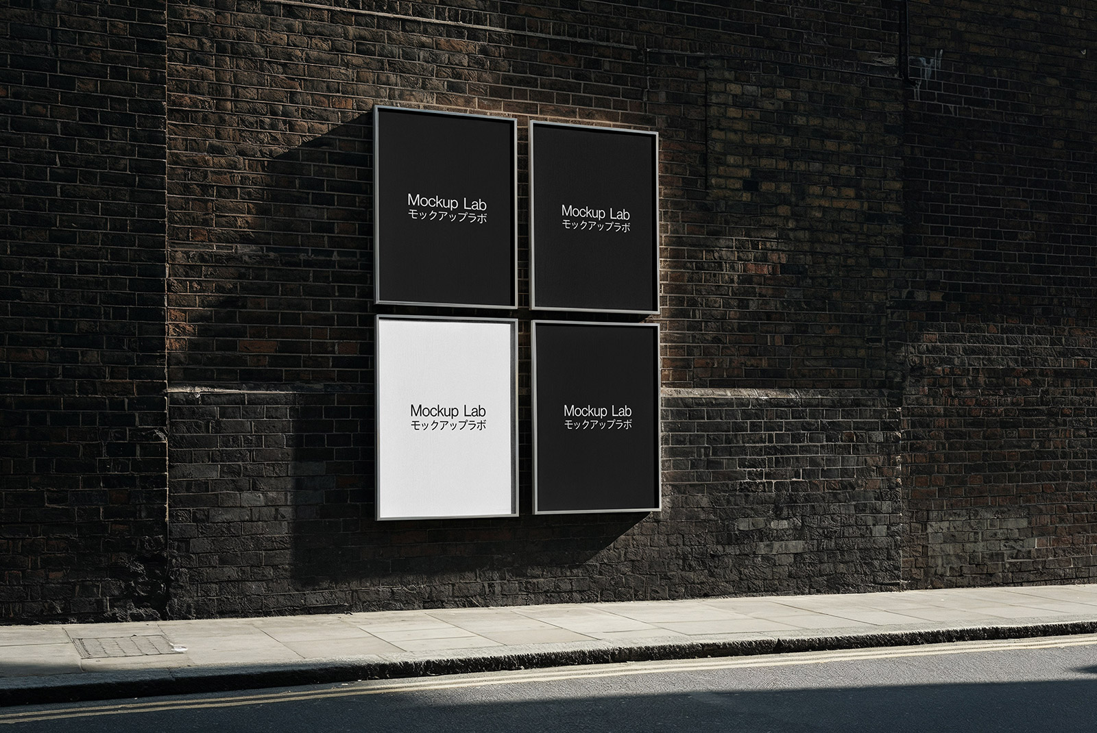 Close-up view of two vertical posters mounted on a textured wall, showcasing design details.